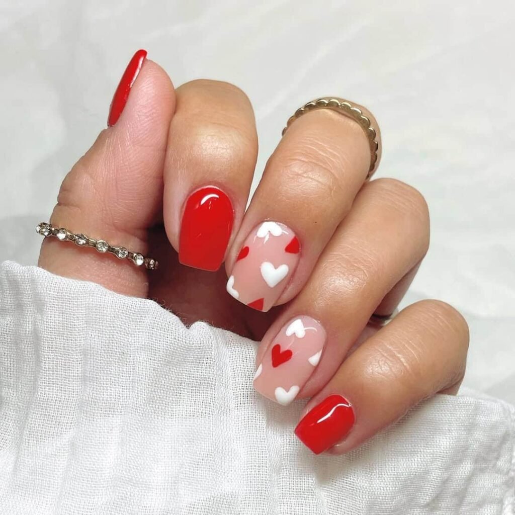 Bright red with heart accent nails