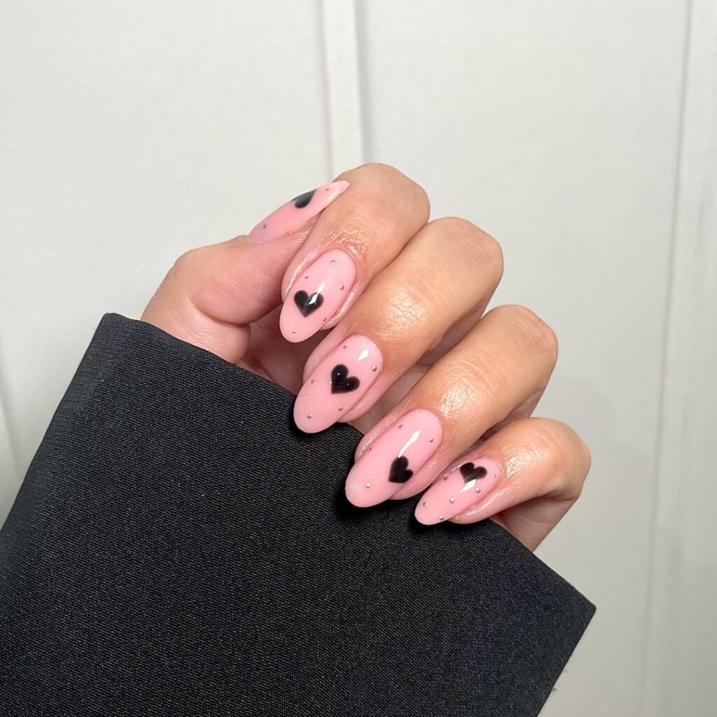 Light pink with black hearts and silver dots