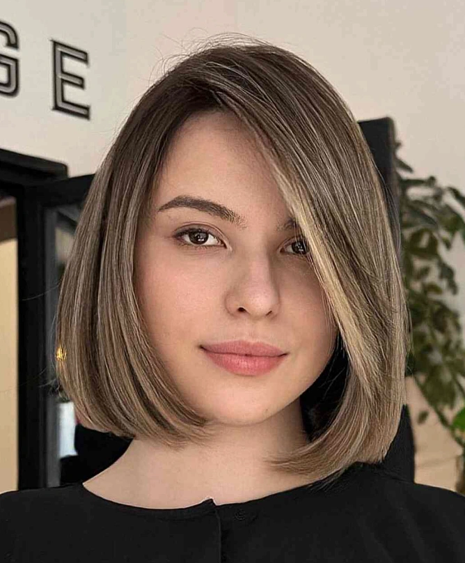 Polished Jaw Length Bob with Face Framing Highlights