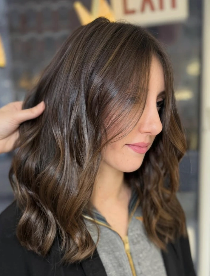Soft Caramel Highlights in Wavy Brown Hair